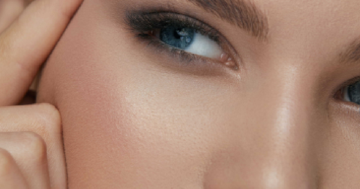 Close-up of a woman highlighting her lifted look after a Non-Surgical Eye Lift in Wilmington, NC.